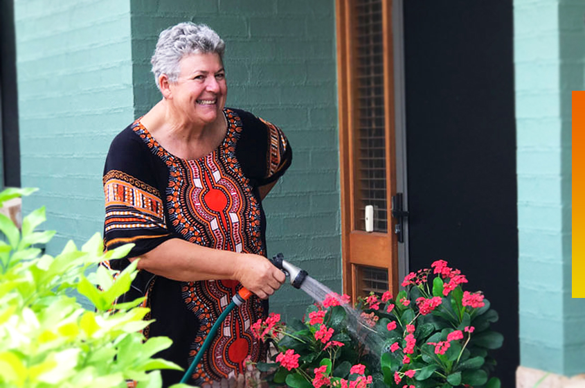 over-55-resident-watering-garden